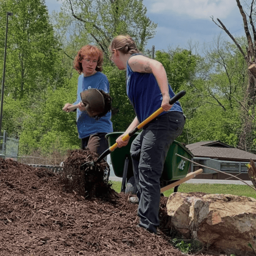 Project MARS members shoveling mulch